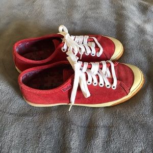 Red suede Keds sneakers